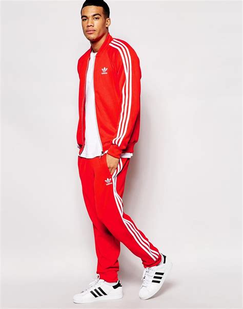 red adidas jogging suit.